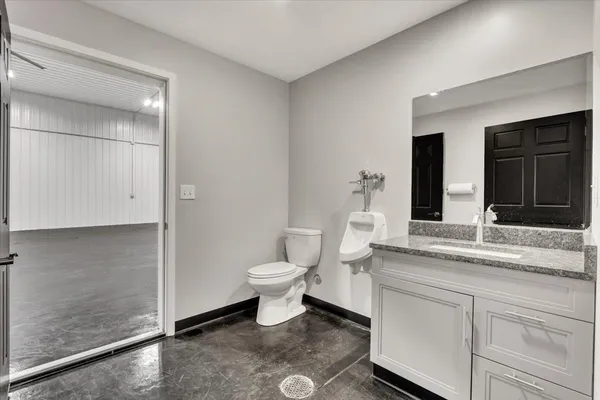 a kitchen with stainless steel appliances granite countertop a refrigerator and a stove