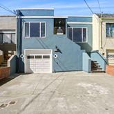 a front view of a house with a garage