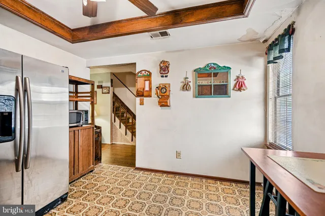 a view of livingroom with furniture and refrigerator