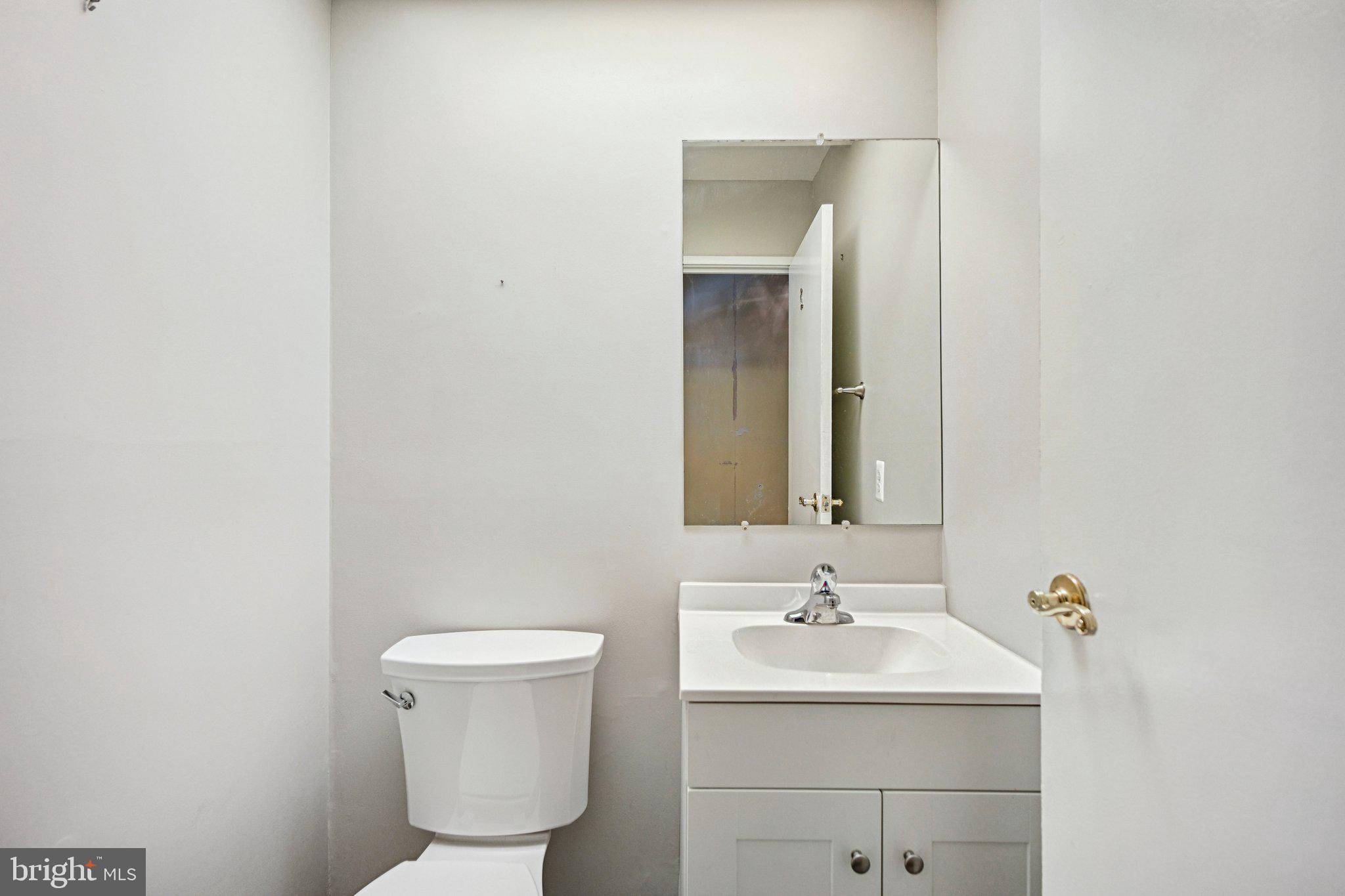 1502 Bromley Estate Pine Hill, NJ 08021 - Photo 18 of 36 a bathroom with a toilet sink and mirror
