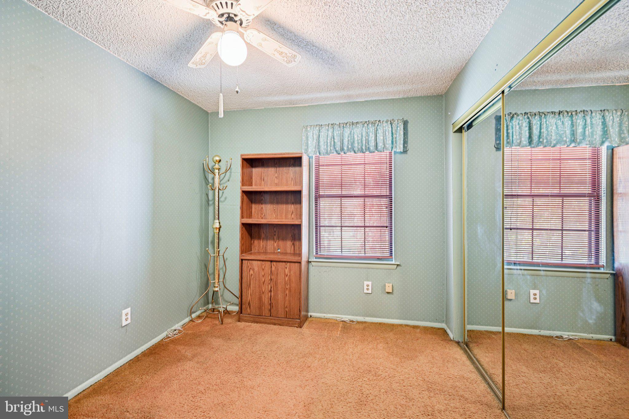 1502 Bromley Estate Pine Hill, NJ 08021 - Photo 19 of 36 an empty room with windows and cabinet
