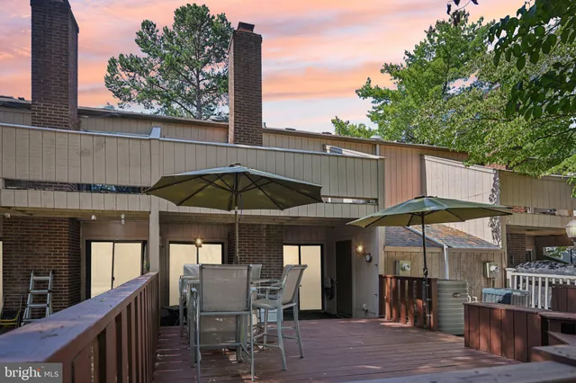 an outdoor space with furniture and umbrella