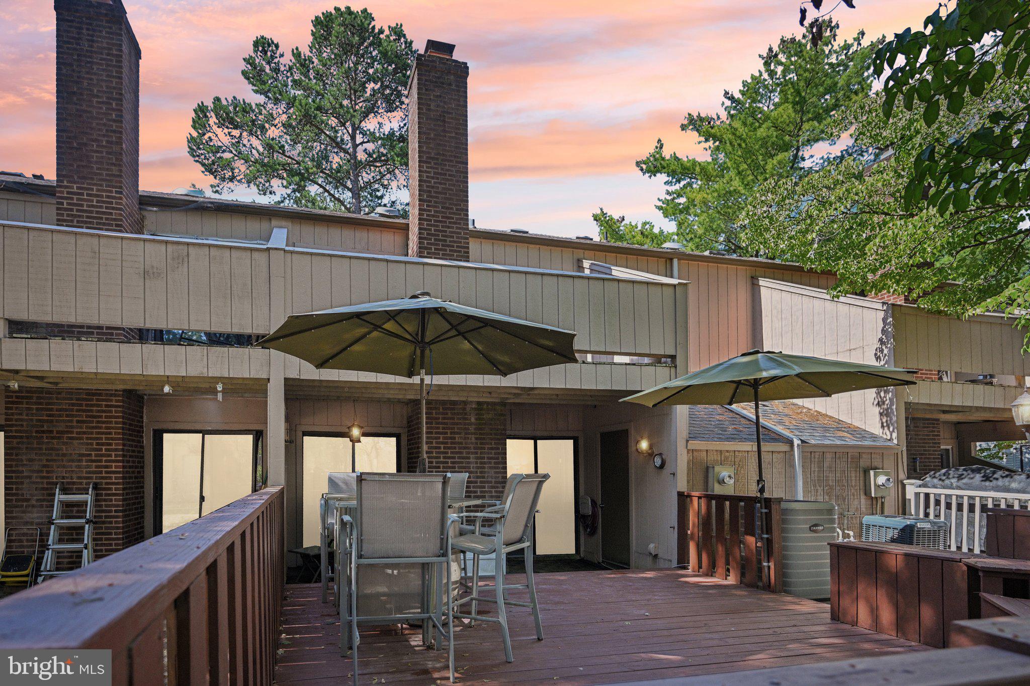 1502 Bromley Estate Pine Hill, NJ 08021 - Photo 2 of 36 an outdoor space with furniture and umbrella