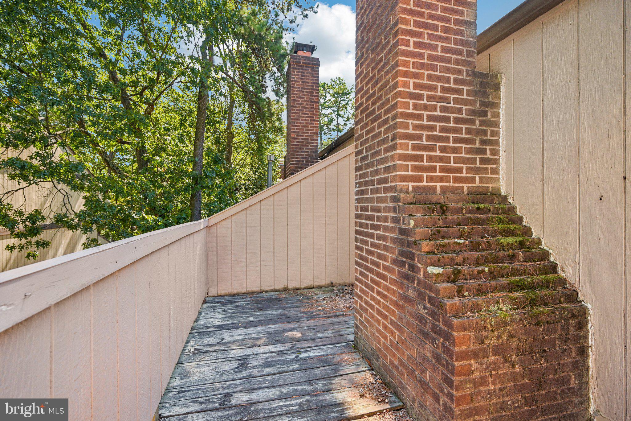 1502 Bromley Estate Pine Hill, NJ 08021 - Photo 35 of 36 a view of a balcony with wooden floor and fence