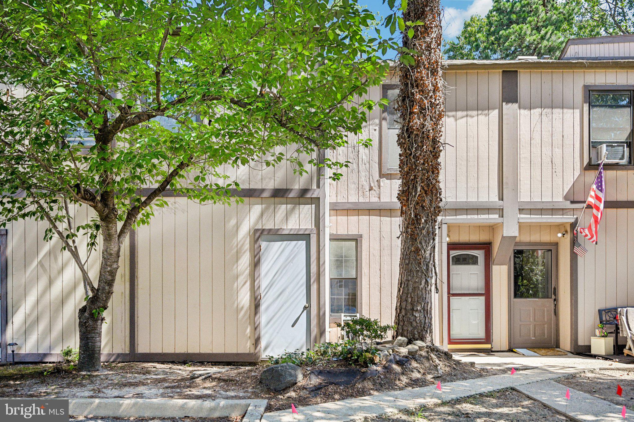 1502 Bromley Estate Pine Hill, NJ 08021 - Photo 4 of 36 a view of a house with a tree next to a yard