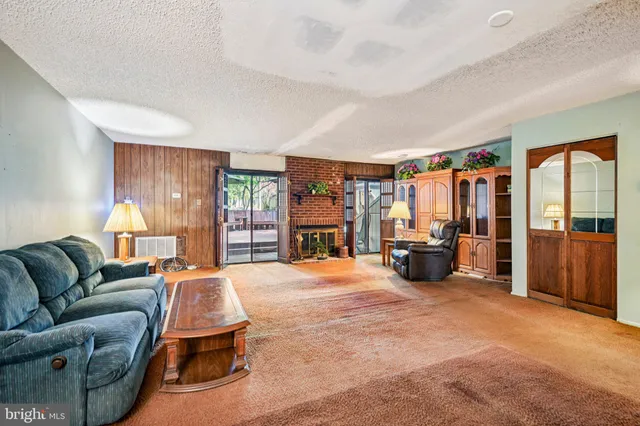 a bed room with furniture and a large window