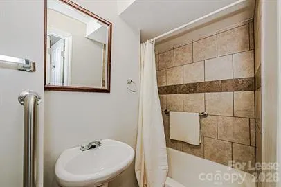 a bathroom with a sink and mirror