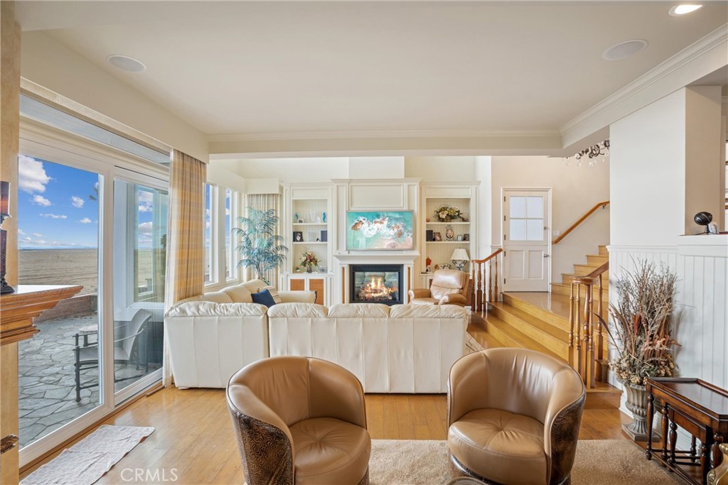 1008 West Oceanfront Newport Beach, CA 92661 - Photo 12 of 59 a living room with furniture and a floor to ceiling window