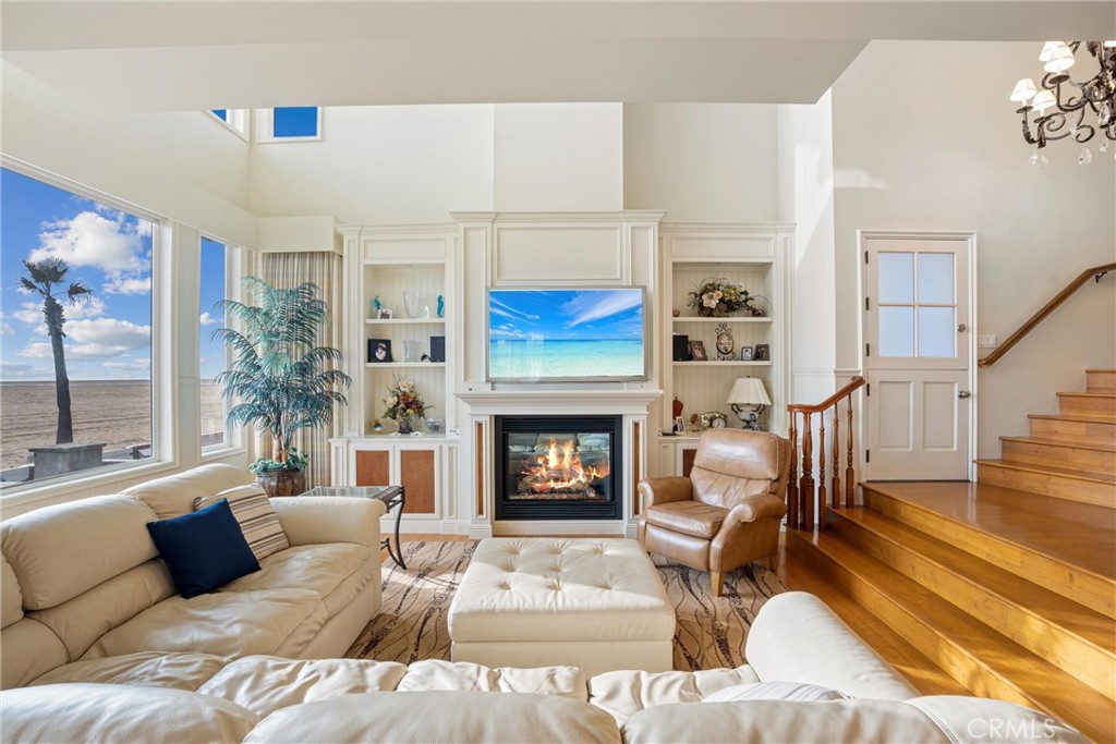 1008 West Oceanfront Newport Beach, CA 92661 - Photo 13 of 59 a living room with furniture and a fireplace
