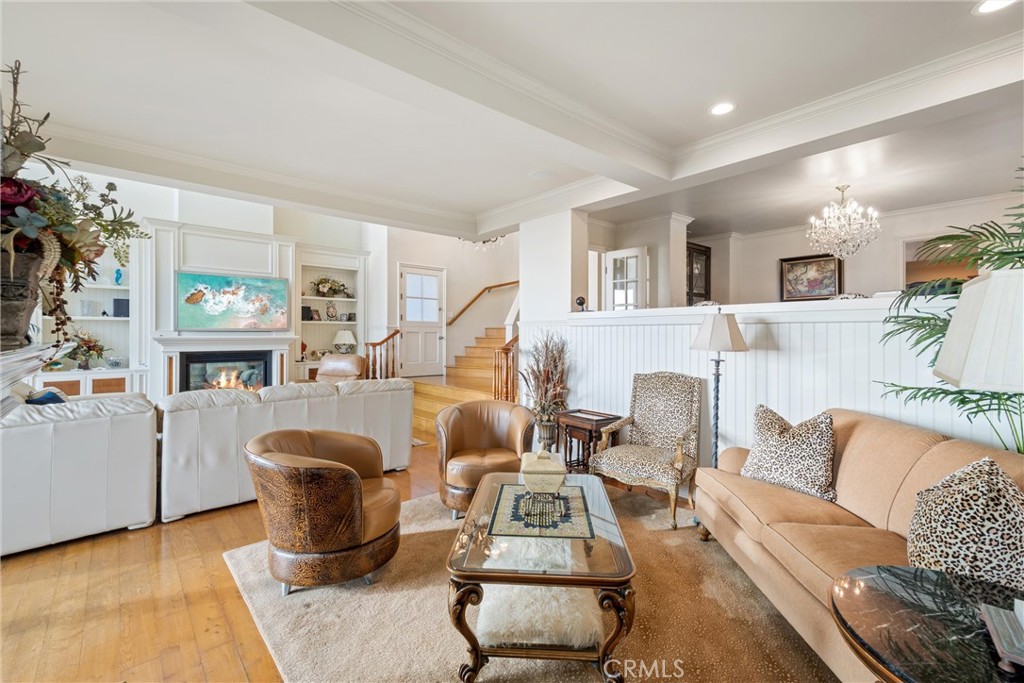 1008 West Oceanfront Newport Beach, CA 92661 - Photo 16 of 59 a living room with furniture a fireplace and a window