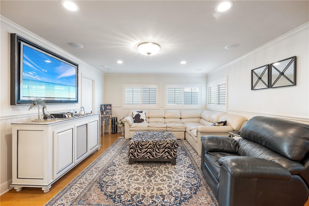 1008 West Oceanfront Newport Beach, CA 92661 - Photo 25 of 59 a living room with furniture and a flat screen tv