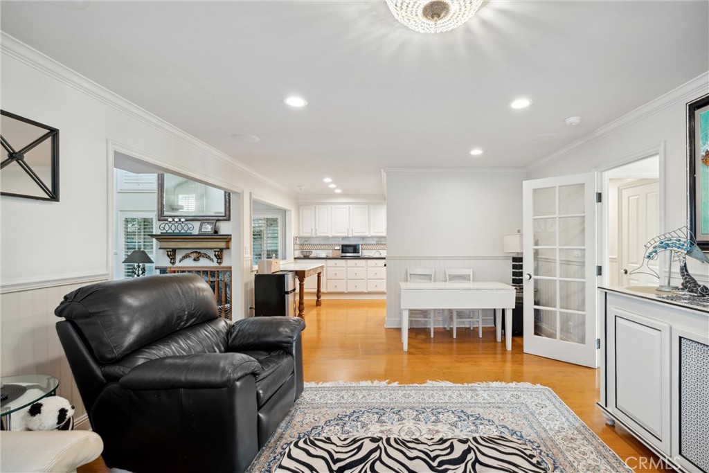 1008 West Oceanfront Newport Beach, CA 92661 - Photo 27 of 59 a living room with furniture and a wooden floor