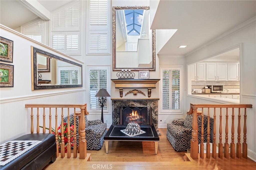 1008 West Oceanfront Newport Beach, CA 92661 - Photo 28 of 59 a living room with furniture a fireplace and a window