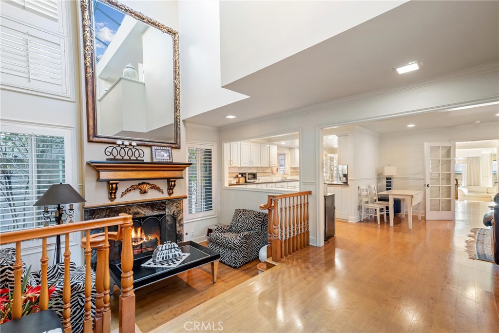 1008 West Oceanfront Newport Beach, CA 92661 - Photo 29 of 59 a living room with furniture fireplace and a large window