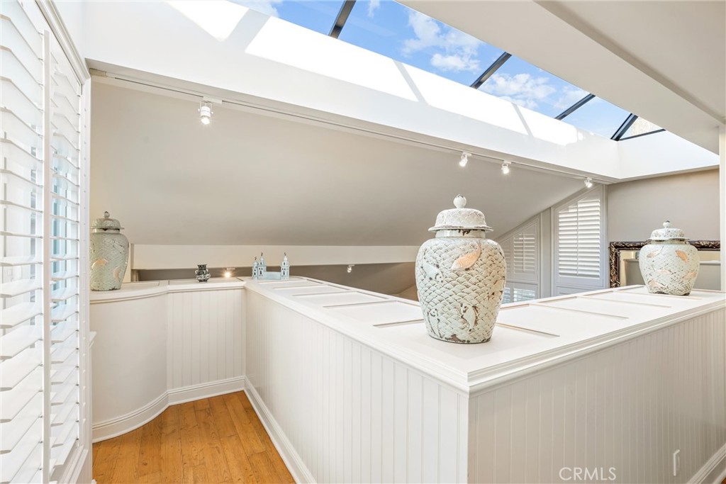 1008 West Oceanfront Newport Beach, CA 92661 - Photo 33 of 59 a kitchen with a sink and chandelier