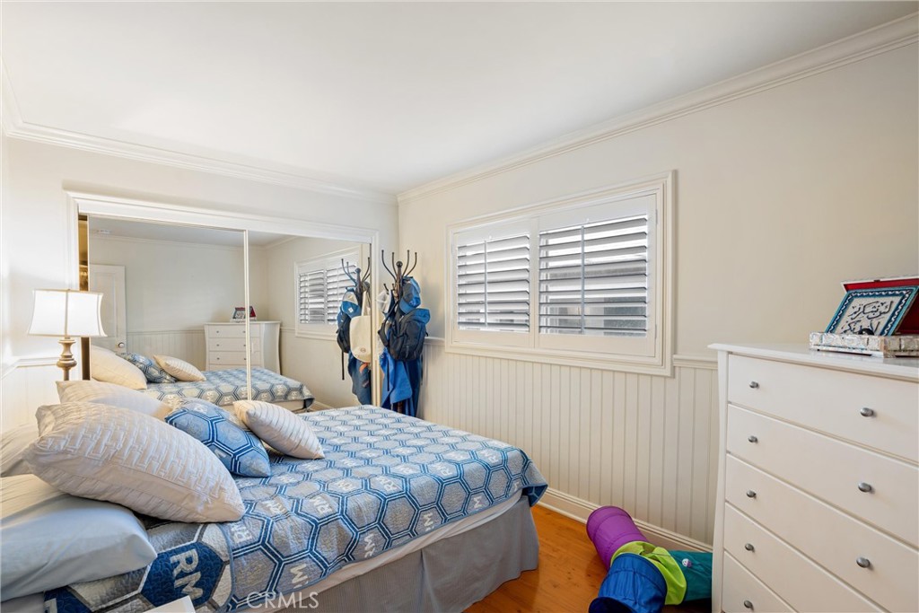 1008 West Oceanfront Newport Beach, CA 92661 - Photo 36 of 59 a bedroom with a bed and with furniture