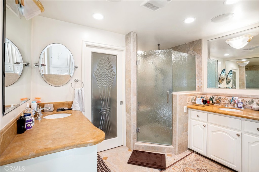1008 West Oceanfront Newport Beach, CA 92661 - Photo 45 of 59 a bathroom with a double vanity sink mirror and shower