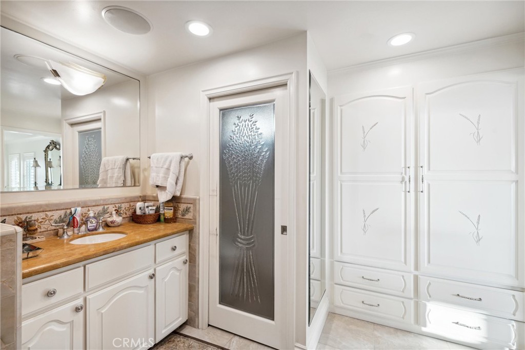 1008 West Oceanfront Newport Beach, CA 92661 - Photo 46 of 59 a bathroom with a sink and a mirror