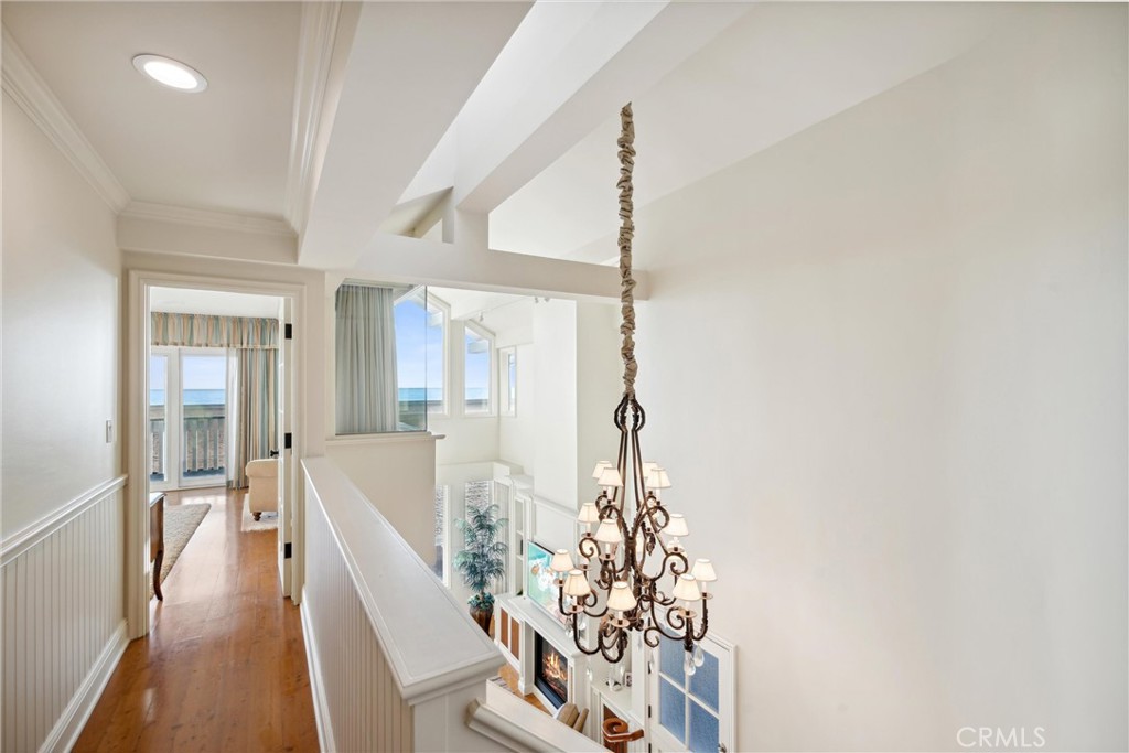 1008 West Oceanfront Newport Beach, CA 92661 - Photo 47 of 59 a living room with furniture and a chandelier