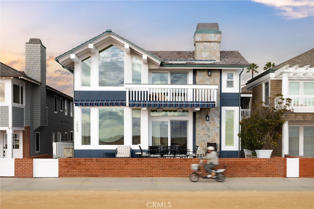 1008 West Oceanfront Newport Beach, CA 92661 - Photo 59 of 59 a front view of a house with glass windows and refrigerator