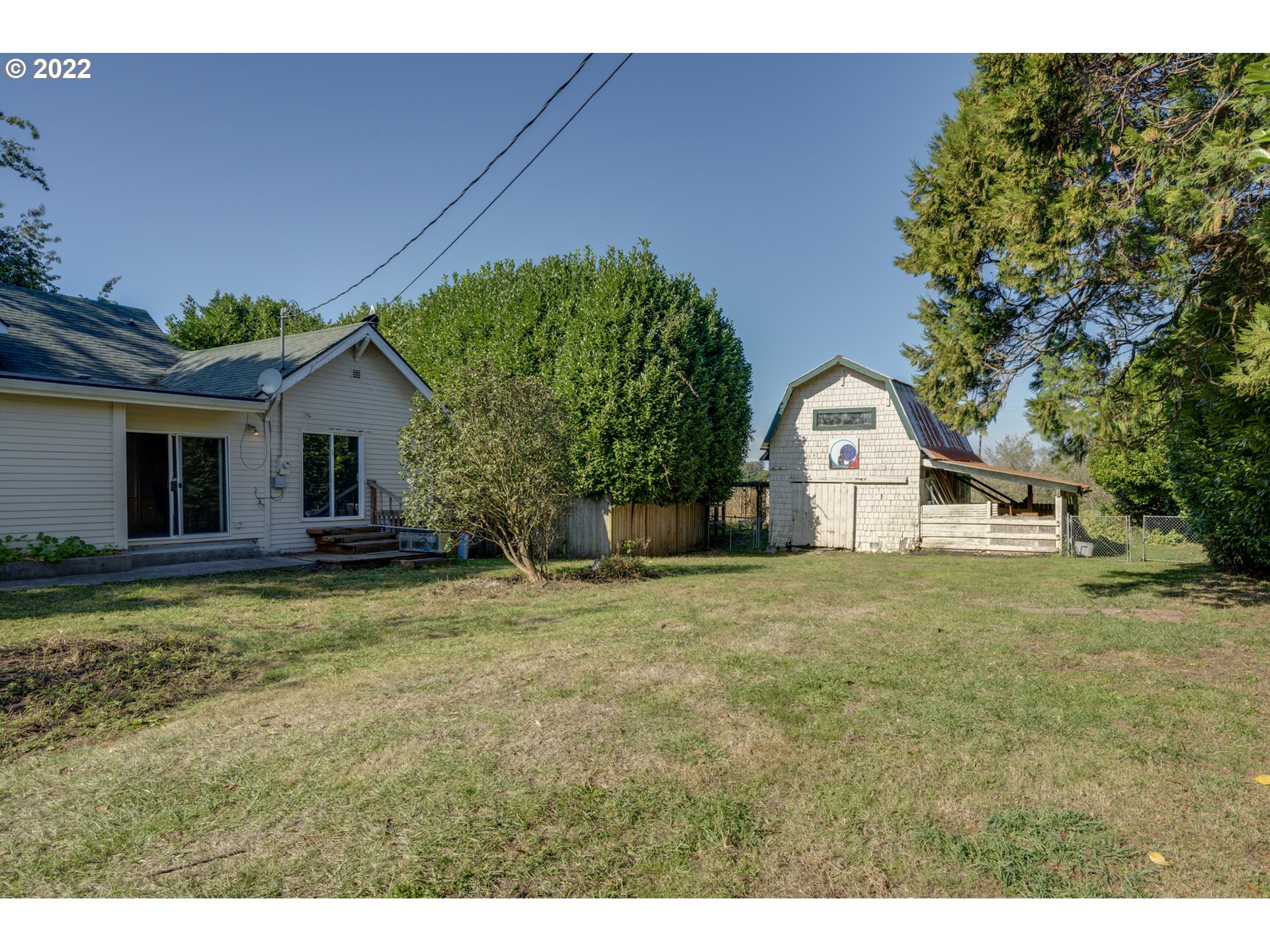 2110 Nielsen Road Tillamook, OR 97141 - Photo 24 of 26 a front view of a house with a garden and yard
