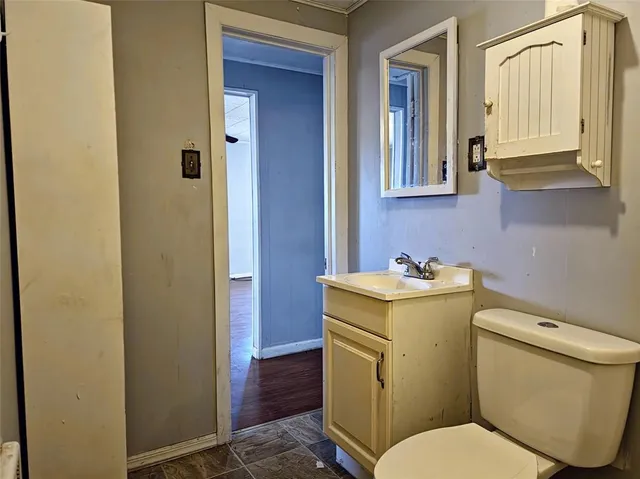 a bathroom with a toilet and a sink
