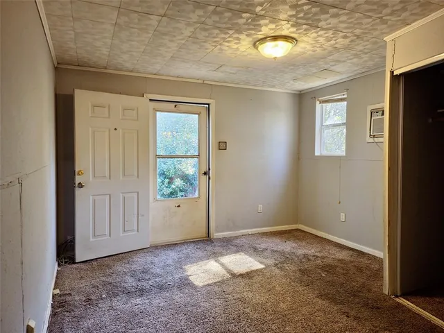 an empty room that has a window in it