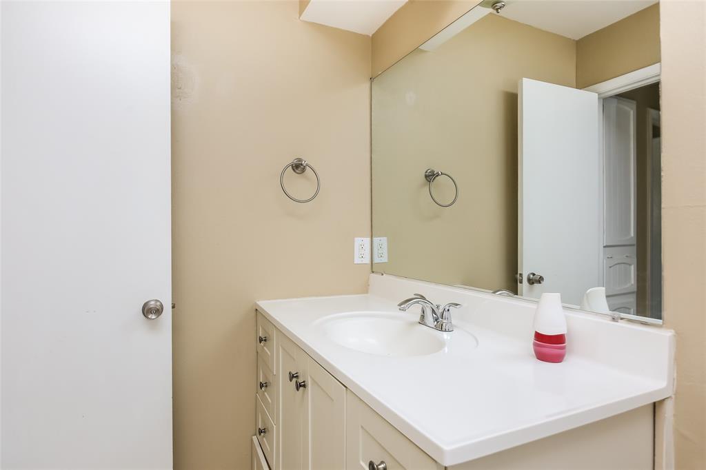 1130 Judy Avenue Benbrook, TX 76126 - Photo 14 of 17 a bathroom with a sink and a mirror