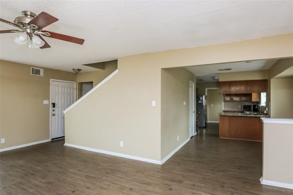 1130 Judy Avenue Benbrook, TX 76126 - Photo 4 of 17 a view of a kitchen with a sink cabinets and wooden floor