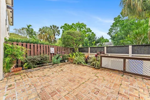a view of a backyard with a fence