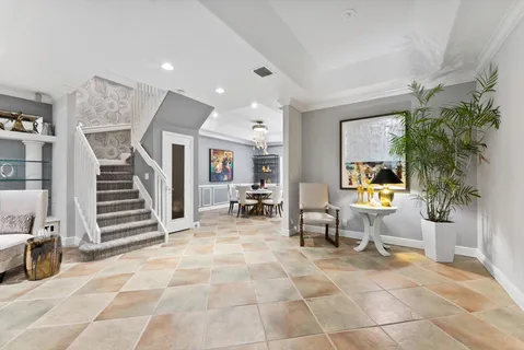 a living room with furniture a dining table a table and chairs