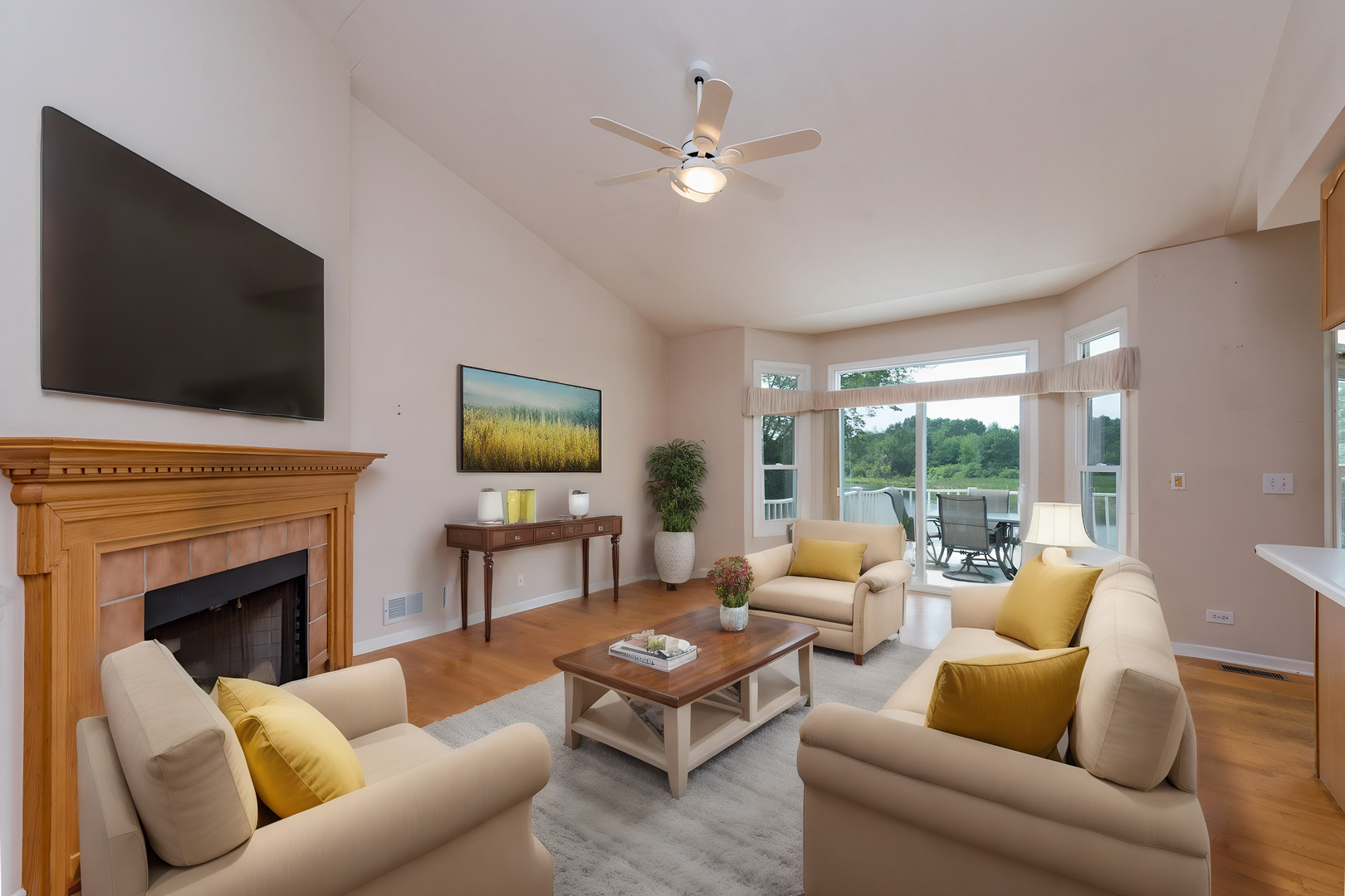 1146 Edgewater Lane Antioch, IL 60002 - Photo 12 of 23 a living room with furniture fireplace and a flat screen tv