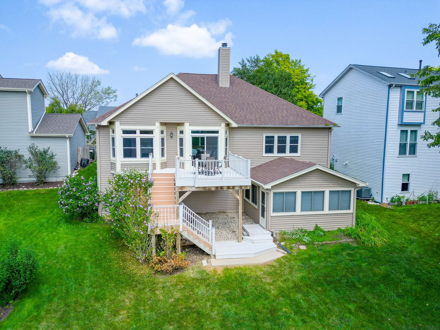1146 Edgewater Lane Antioch, IL 60002 - Photo 6 of 23 a front view of a house with a yard and porch