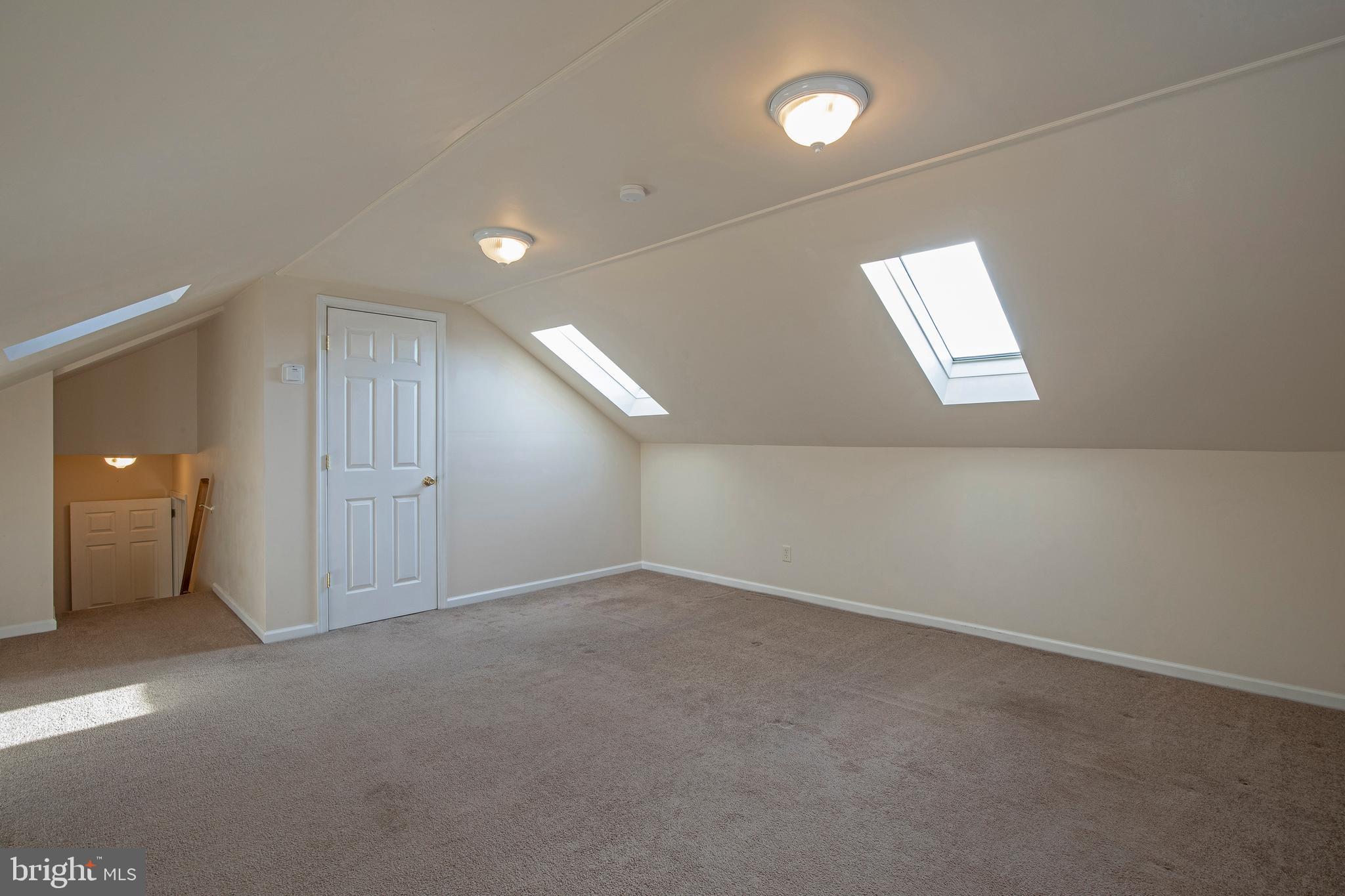34 East Robin Road Holland, PA 18966 - Photo 26 of 38 5th bedroom with closet and entrance to attic