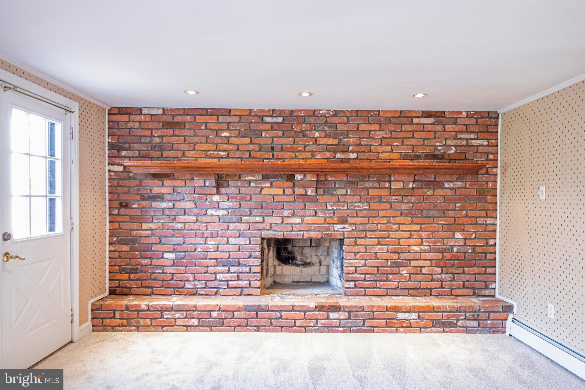Floor-to-ceiling brick hearth in Family Room