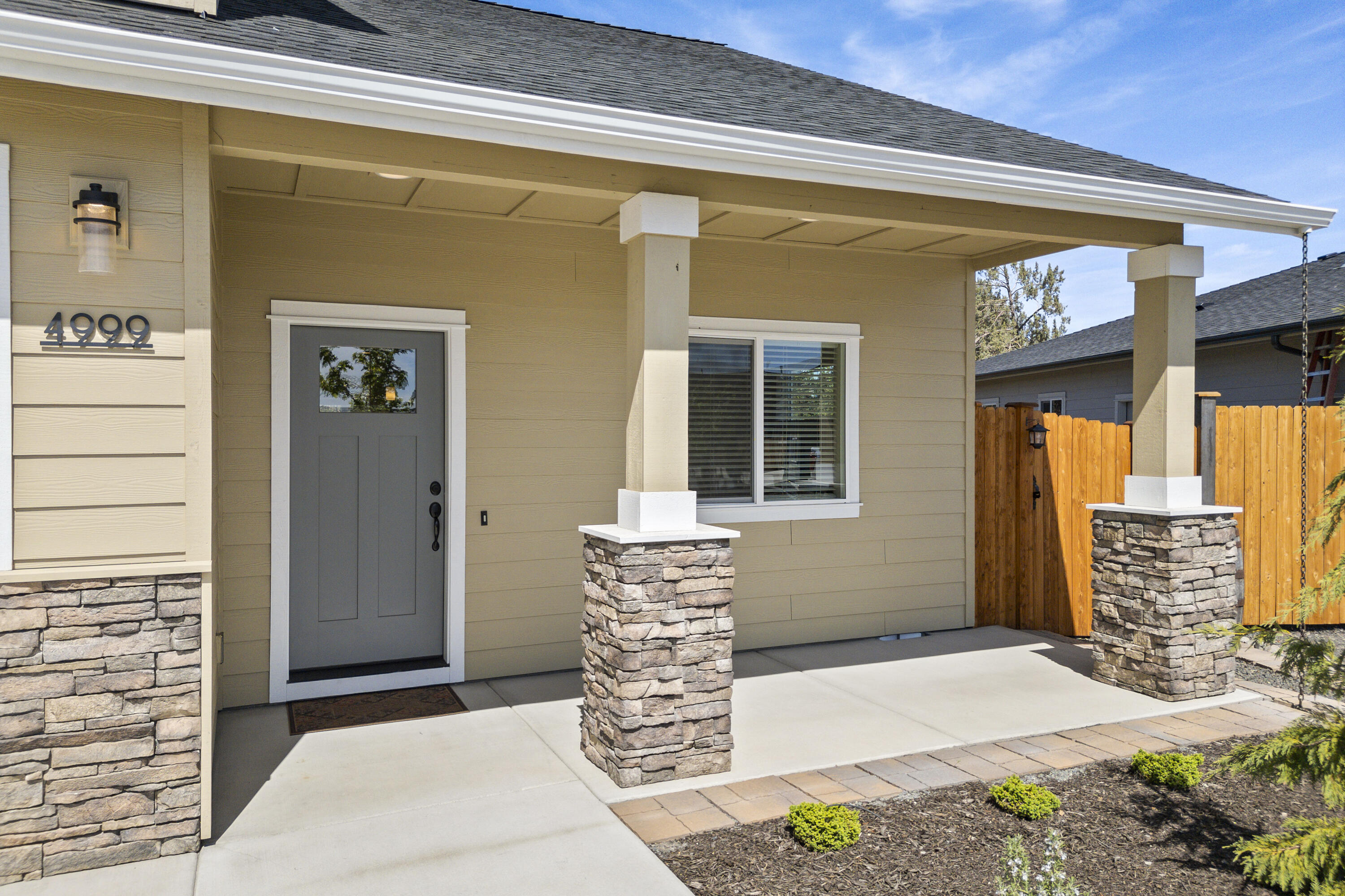 4999 Southwest Yew Place Redmond, OR 97756 - Photo 5 of 50 a front view of a house with windows