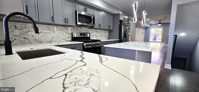 a kitchen with sink and window