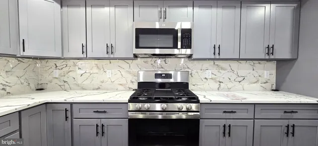 a bedroom with a bed and a mirror