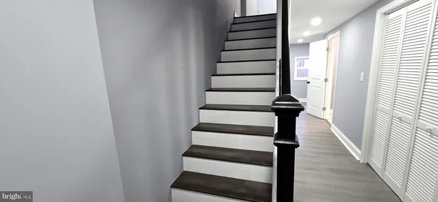 a view of wooden floor and stairs