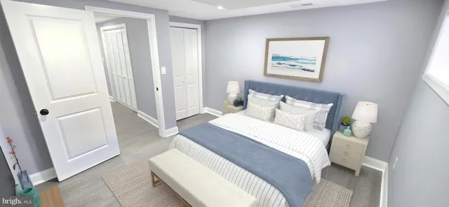 a view of a hallway with wooden floor and entryway