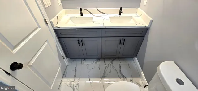 a view of swimming pool with sitting area