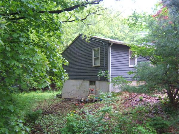 71 King Road Charlton, MA 01507 - Photo 3 of 4 a backyard of a house with lots of green space