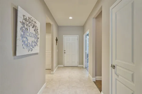 a view of a hallway with paintings on the wall