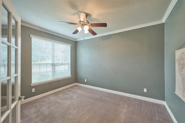a bedroom with furniture and a window