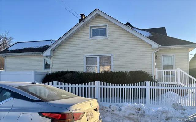 a front view of house with deck
