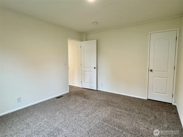 a view of an empty room and entryway
