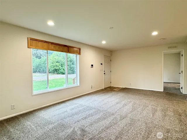a view of an empty room with a window