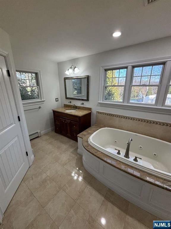 124 Coopers Lane River Vale, NJ 07675 - Photo 24 of 25 a spacious bathroom with a tub sink and mirror