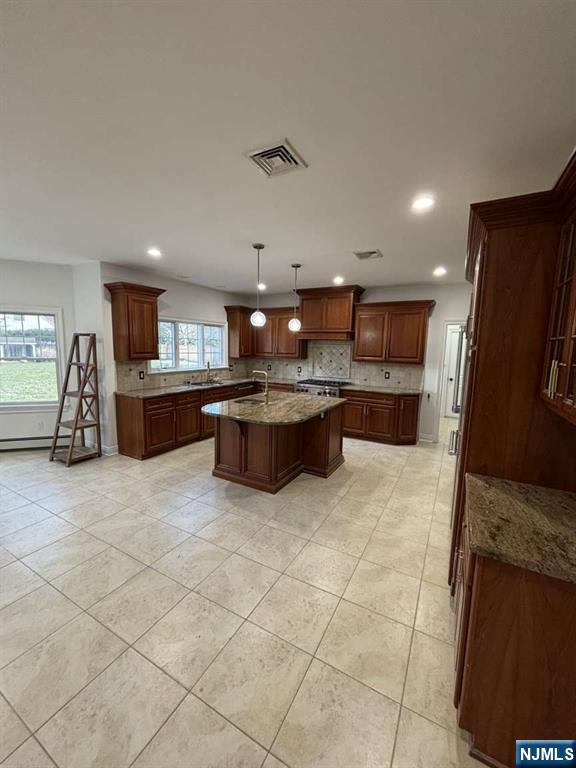 124 Coopers Lane River Vale, NJ 07675 - Photo 9 of 25 a large kitchen with a lot of cabinets and wooden floor