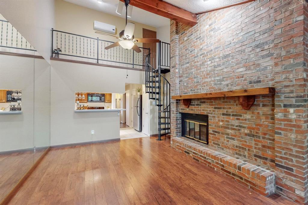 2569 Shady Ridge Drive Bedford, TX 76021 - Photo 12 of 38 a view of empty room with wooden floor and fireplace
